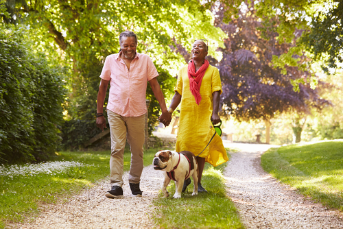 Senior Couple Walking Dog