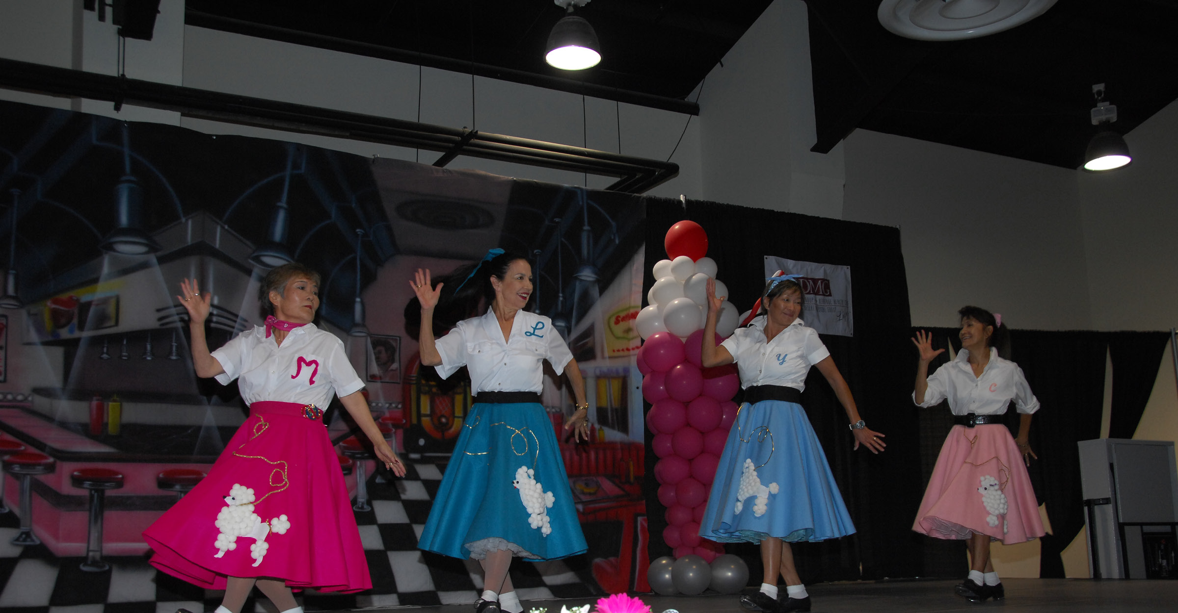 Seniors performing in poodle skirts