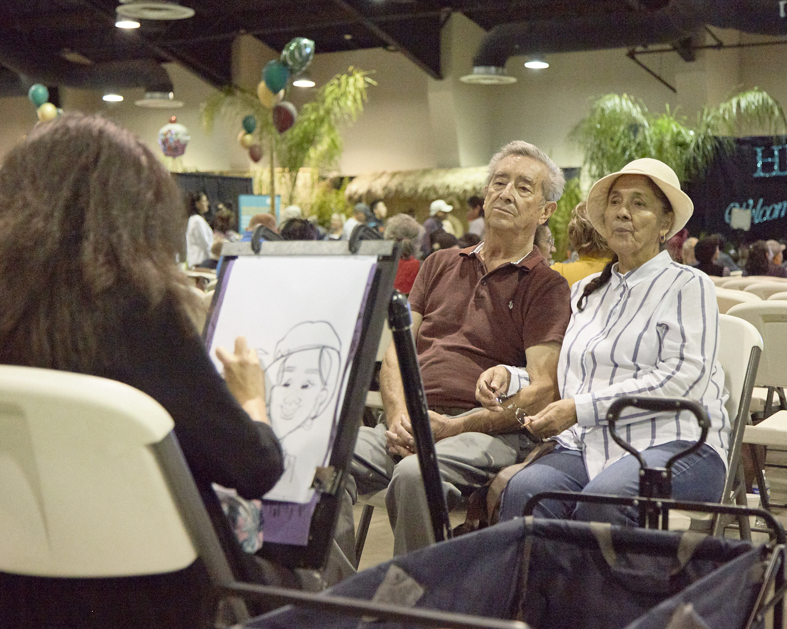 Caricature Artist drawing a couple