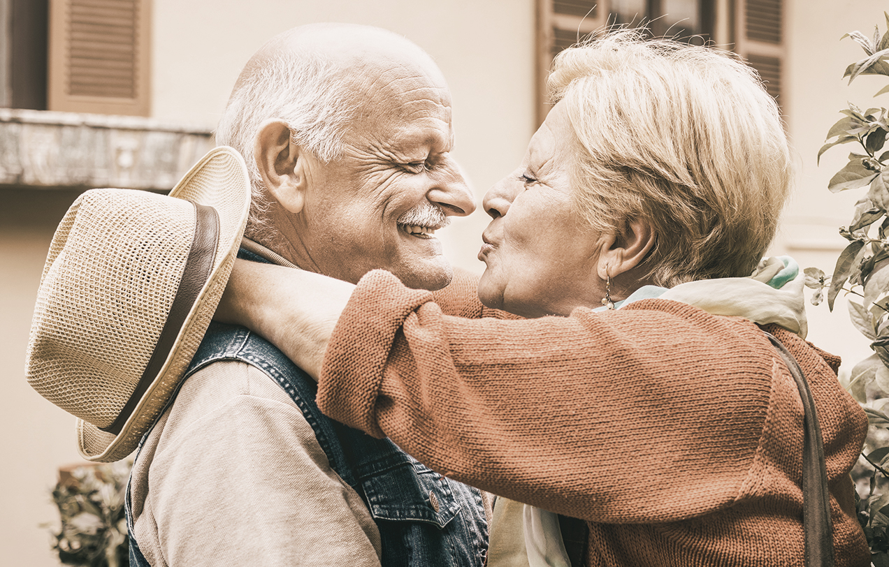 senior couple holding each other